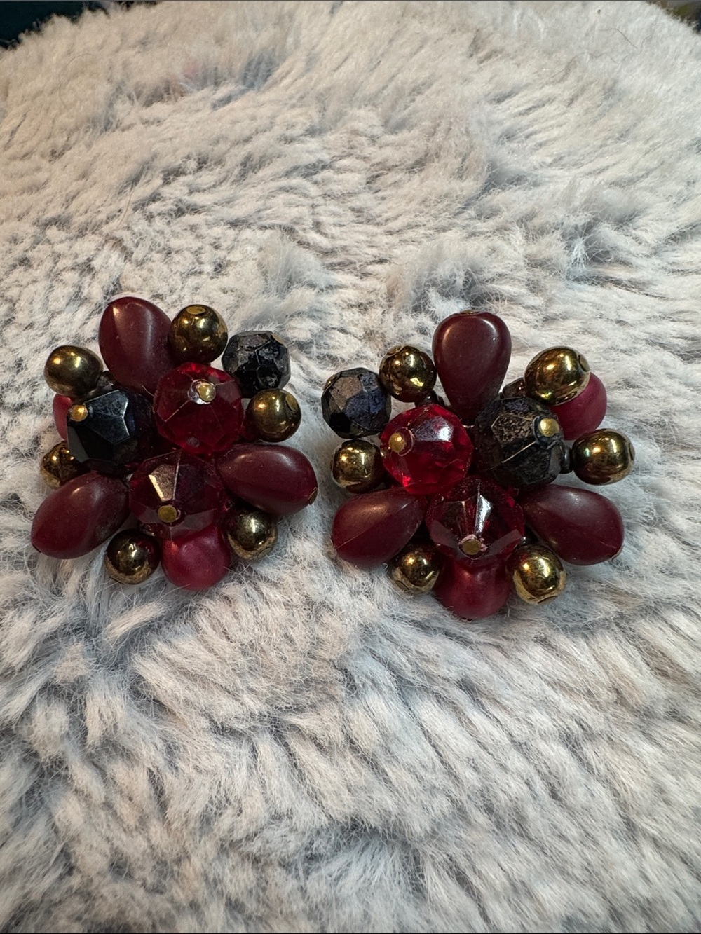 This is a vintage West German beaded cluster clip-on earring.